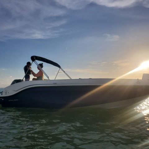 a small boat in a body of water