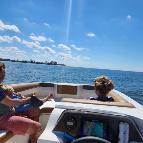 a man standing next to a body of water