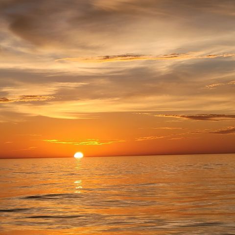 a sunset over some water