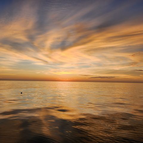 a sunset over a body of water