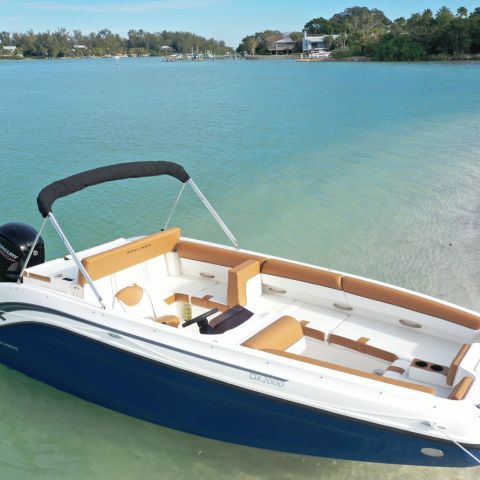 a boat sitting next to a body of water