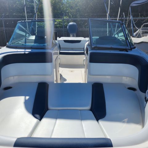 a boat sitting on top of a car