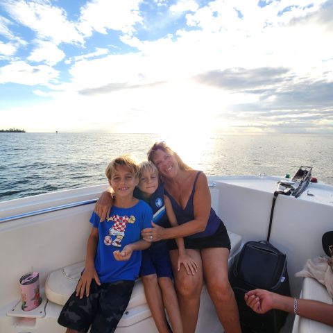 a couple of people on a beach posing for the camera