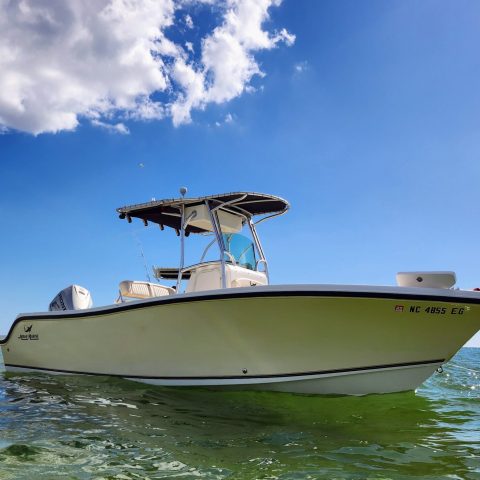 a small boat in a large body of water