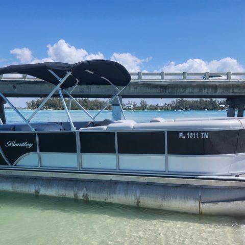 a boat is docked next to a body of water