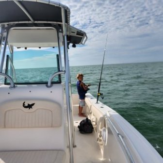 a boat sitting on top of a car