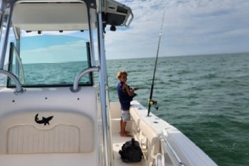 a boat sitting on top of a car