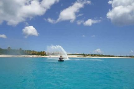 a man riding a rental jet ski in the calming waters of Sarasota