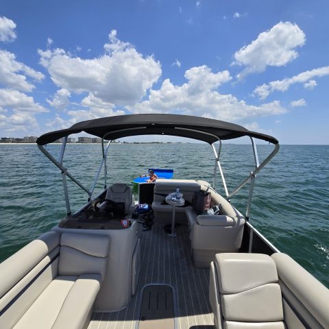 a boat is docked next to a body of water