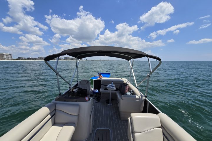 a boat is docked next to a body of water
