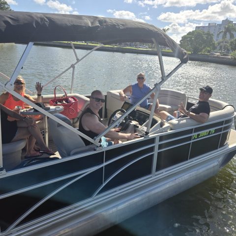 a group of people in a boat on a body of water