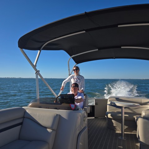 a boat sitting next to a body of water