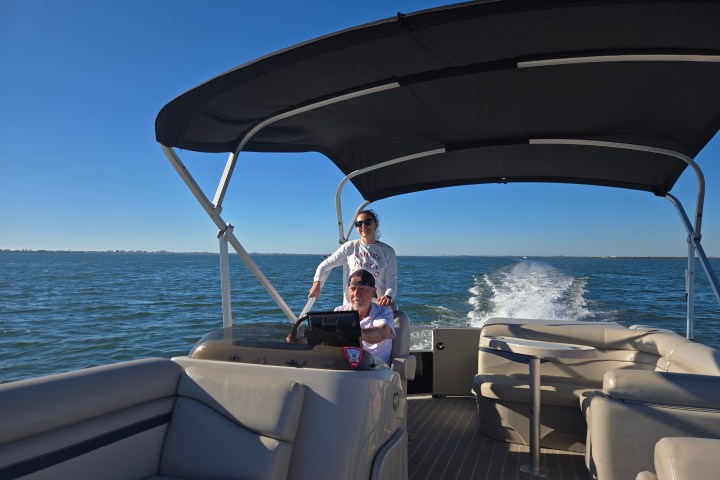 a boat sitting next to a body of water