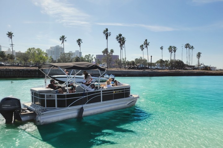 a boat is docked next to a body of water