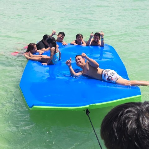 a group of people swimming in a body of water