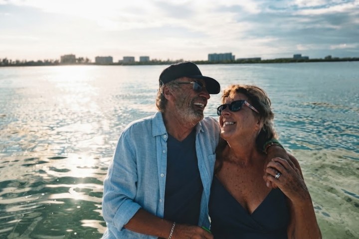 Couple enjoying a private anniversary sunset boat cruise in Sarasota, FL