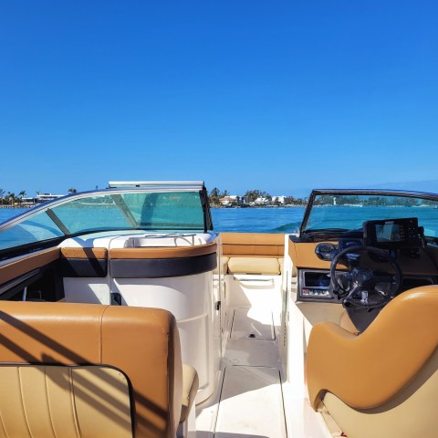 a boat sitting on top of a truck