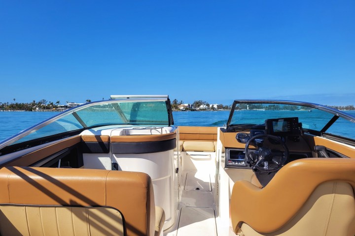 a boat sitting on top of a truck