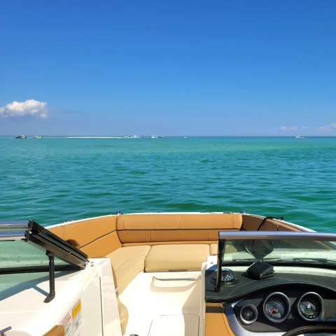 a boat sitting on top of a beach