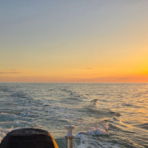 a sunset over a body of water