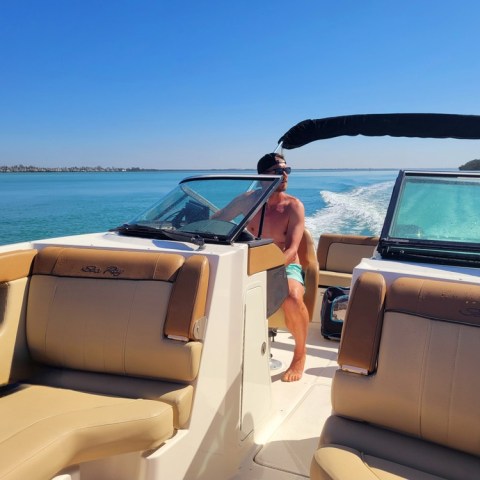 a boat sitting on top of a car