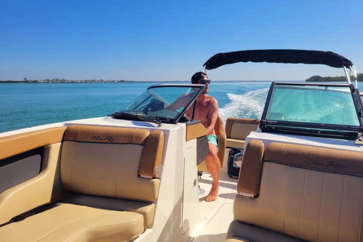 a boat sitting on top of a car